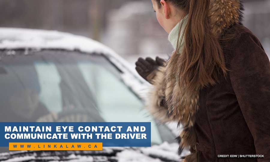 Maintain eye contact and communicate with the driver